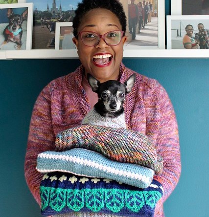 Dana and a stack of sweaters