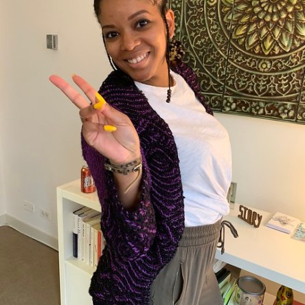 Safia wearing her La Brioheme cardigan